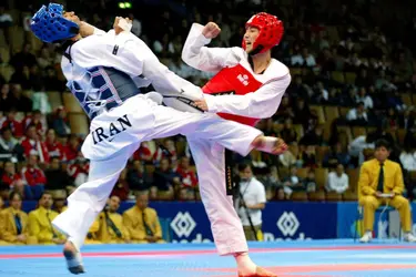 Combat de taekwondo - crédits : © Eddy Lemaistre/ Photo & Co./ Corbis/ VCG/ Getty Images