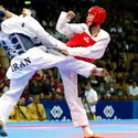 Combat de taekwondo - crédits : © Eddy Lemaistre/ Photo & Co./ Corbis/ VCG/ Getty Images